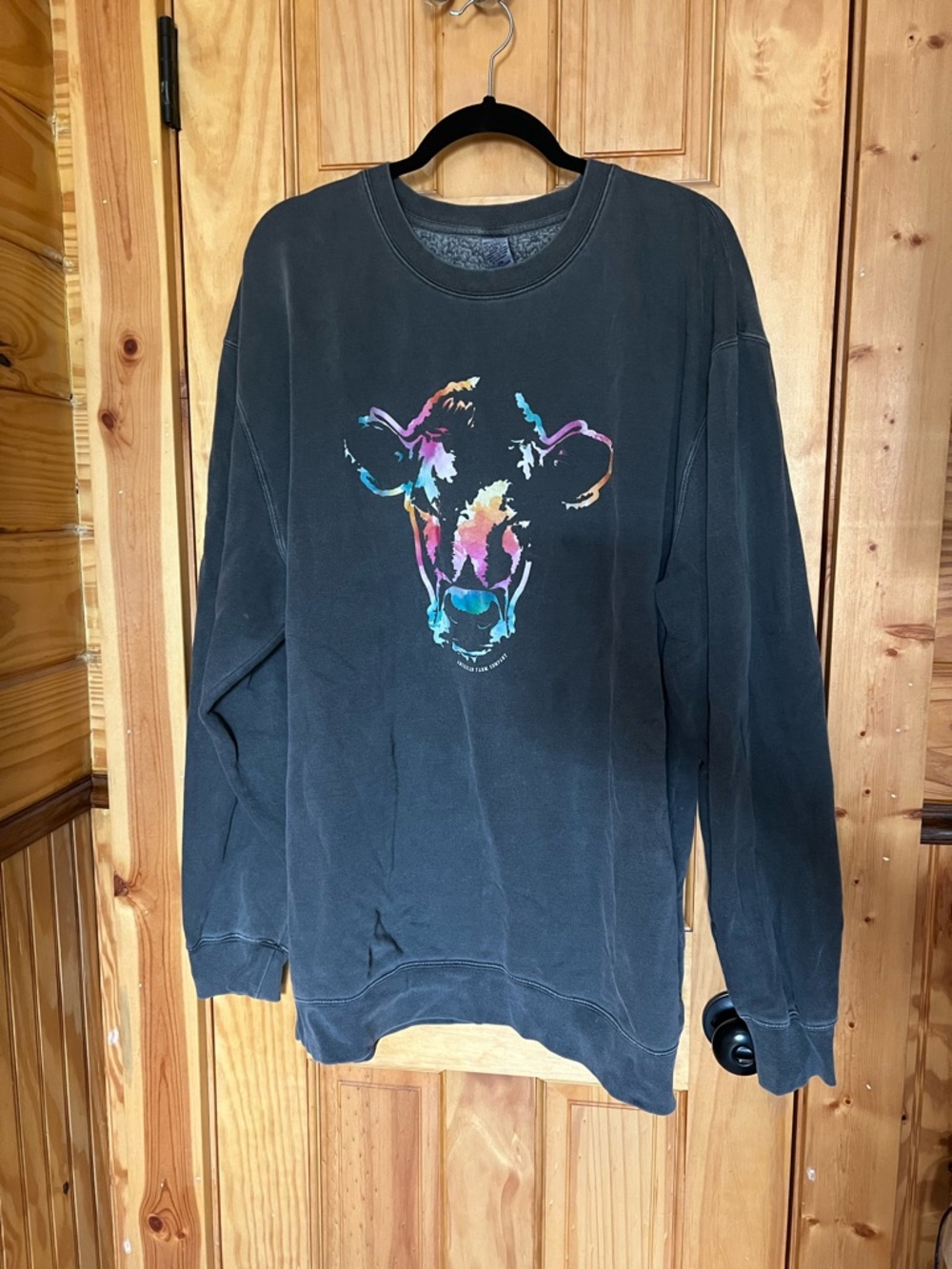 Women's Black Crewneck Sweatshirt with Multicolor Cow Graphic
